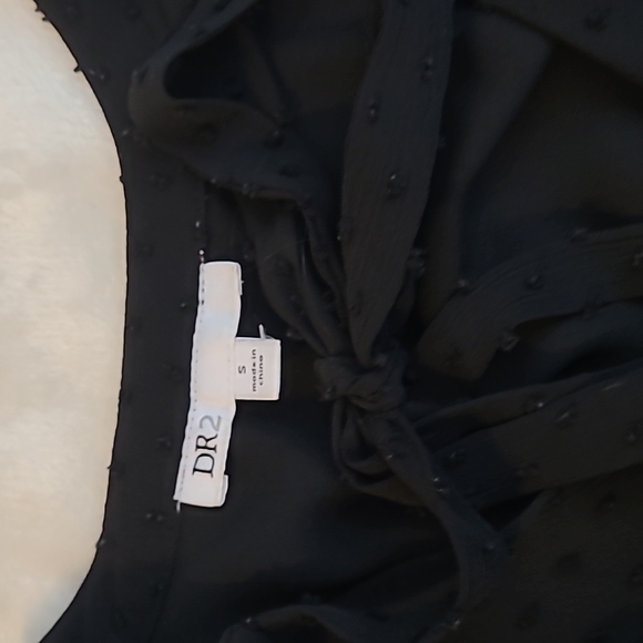 Black Bow Tie Blouse with Polka Sitting and Ruffled Hem - Picture 5 of 6